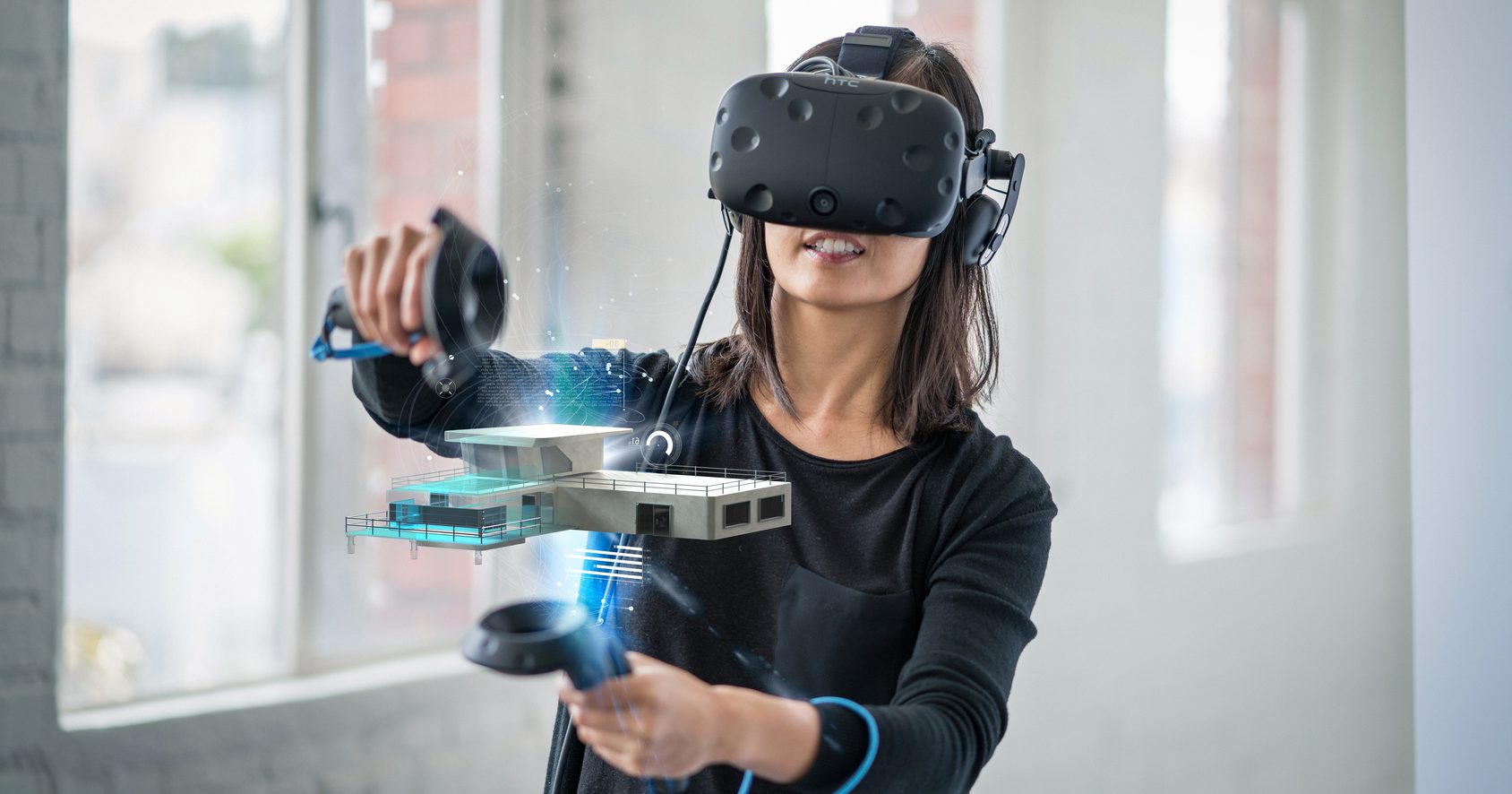 Woman using VR to view model of house